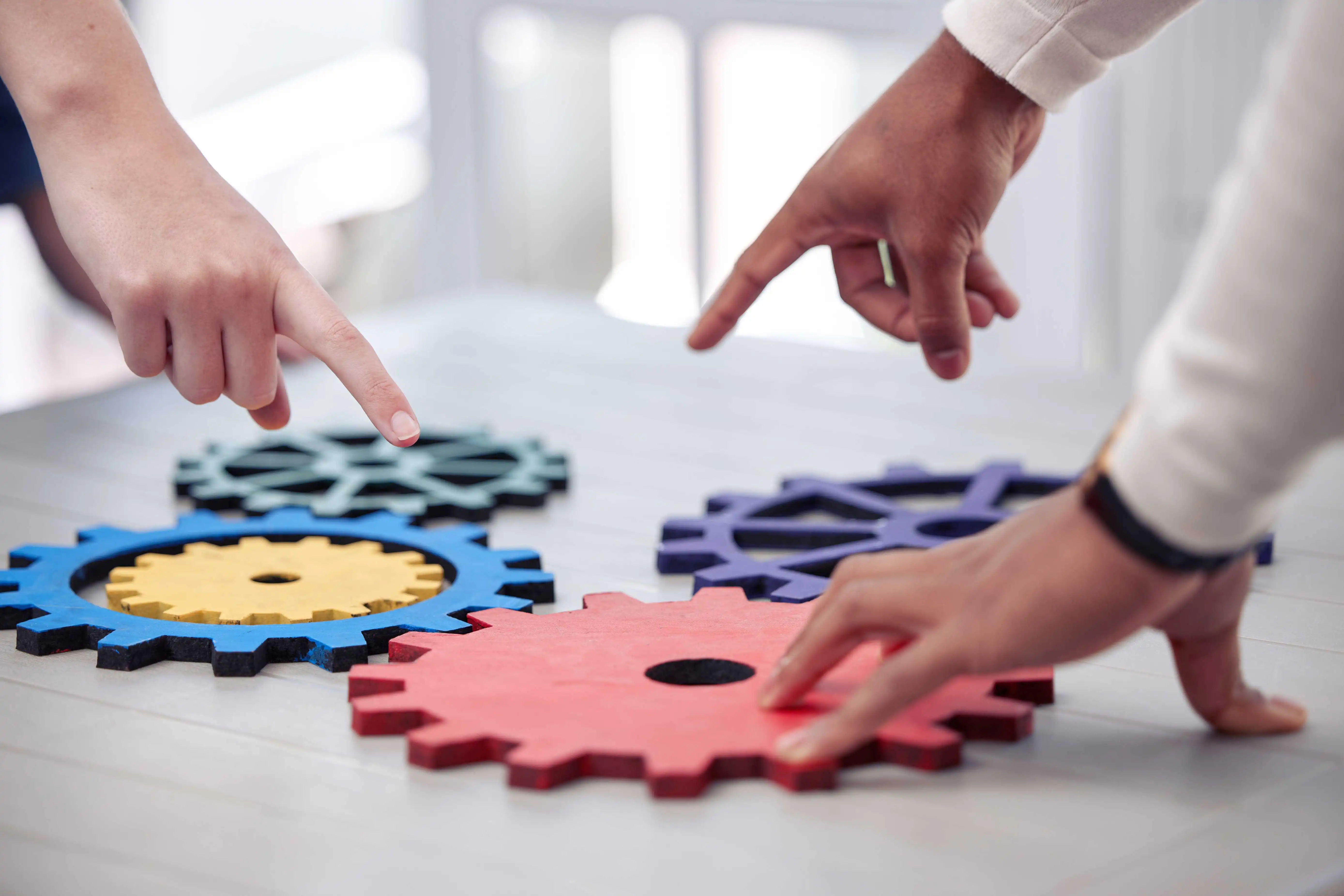 Dynamics Monk illustration of interconnected gears representing the complexities and challenges of migrating to Dynamics 365 Commerce from a legacy B2B portal.